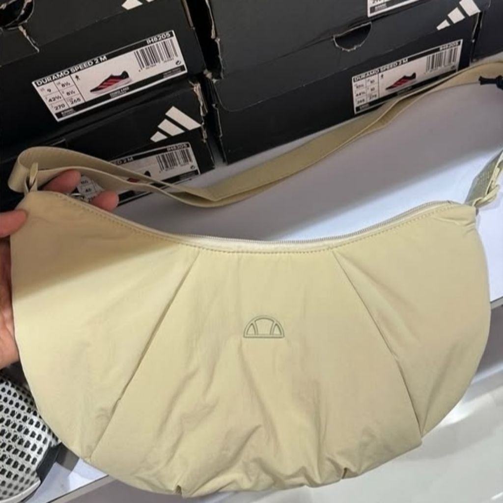 tas ellesse original store sport station