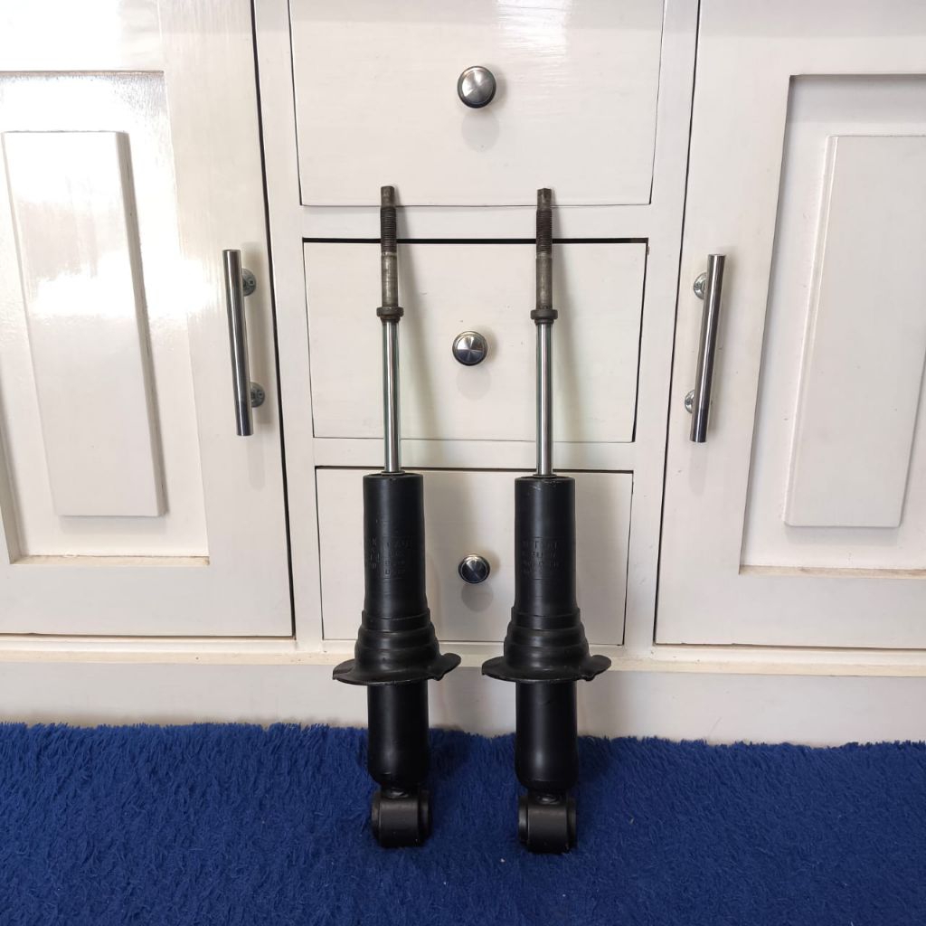 shock nissan navara d40 depan