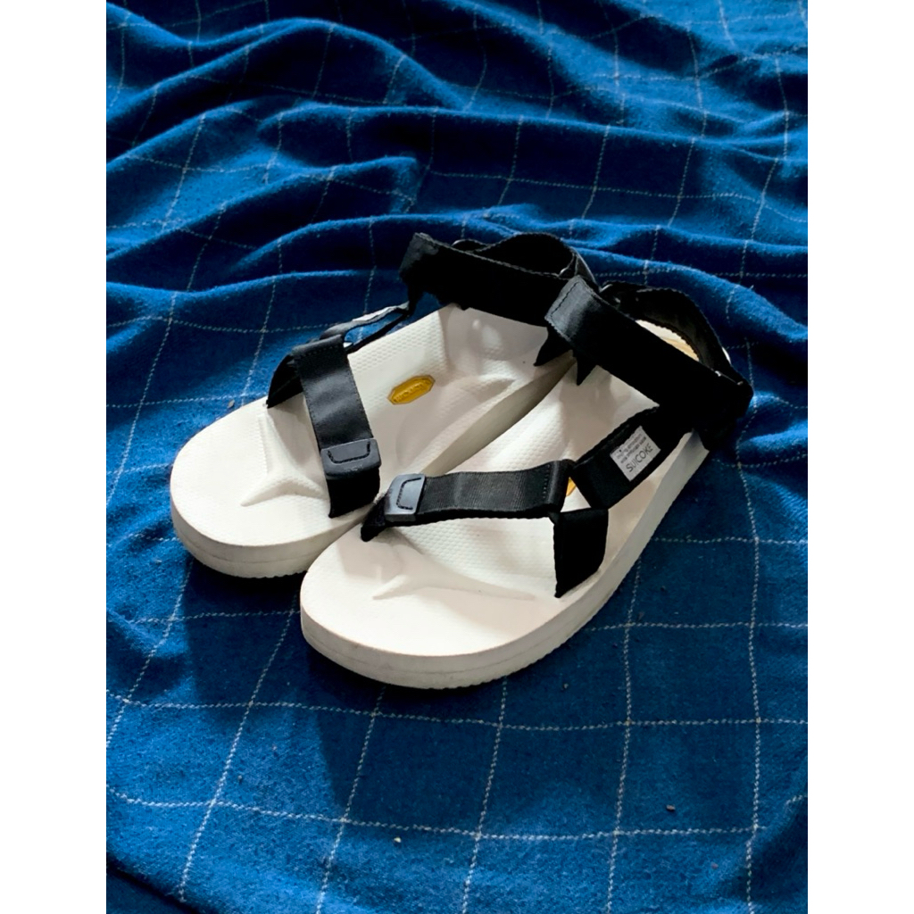 Suicoke DEPA-V2 sandals with black nylon straps and a white Vibram