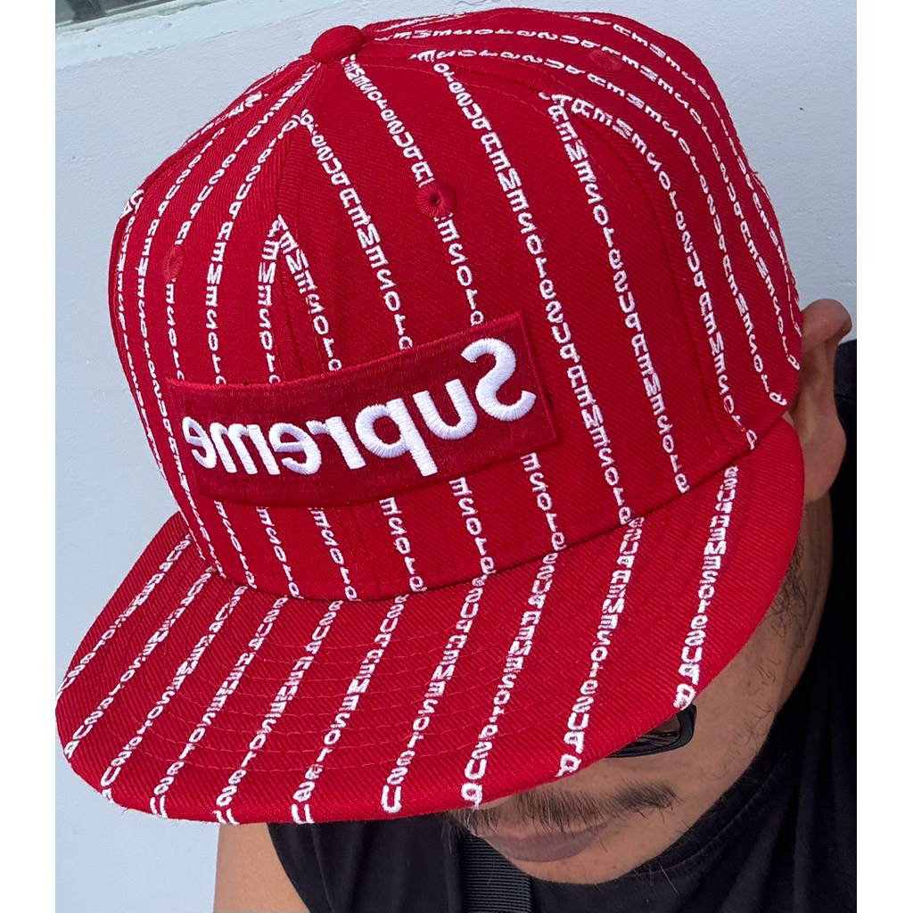 Topi new era x supreme