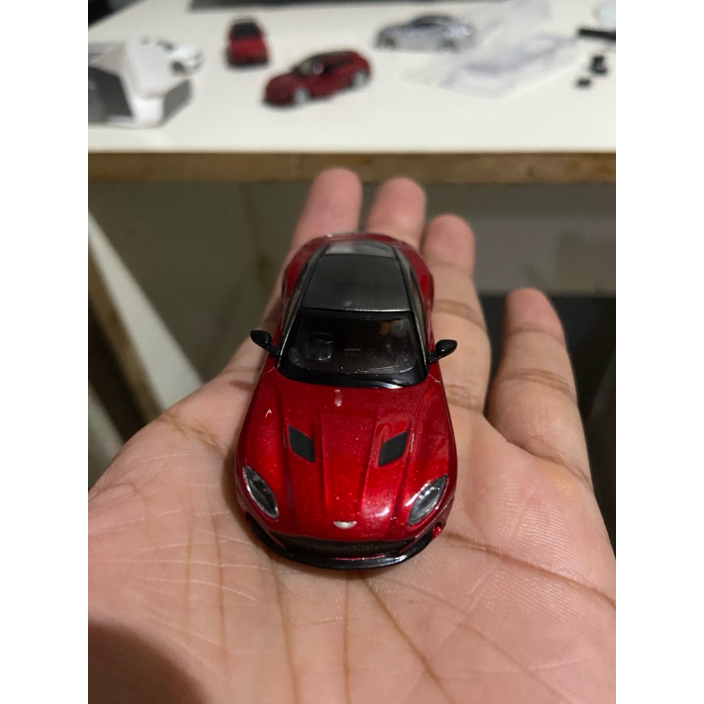 Diecast Mini GT Aston Martin DBS red 1/64.