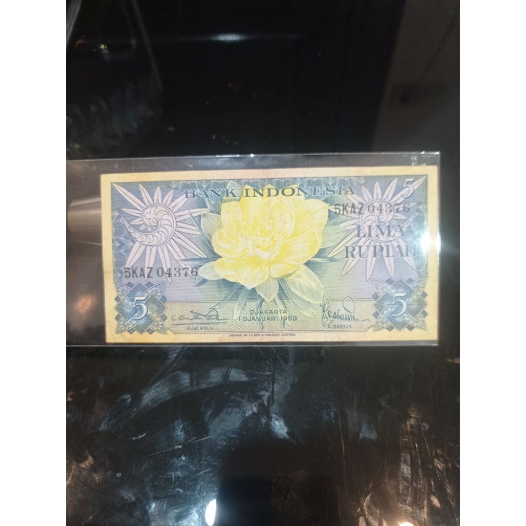 uang kertas kuno 5 rupiah seri bunga bekas edar