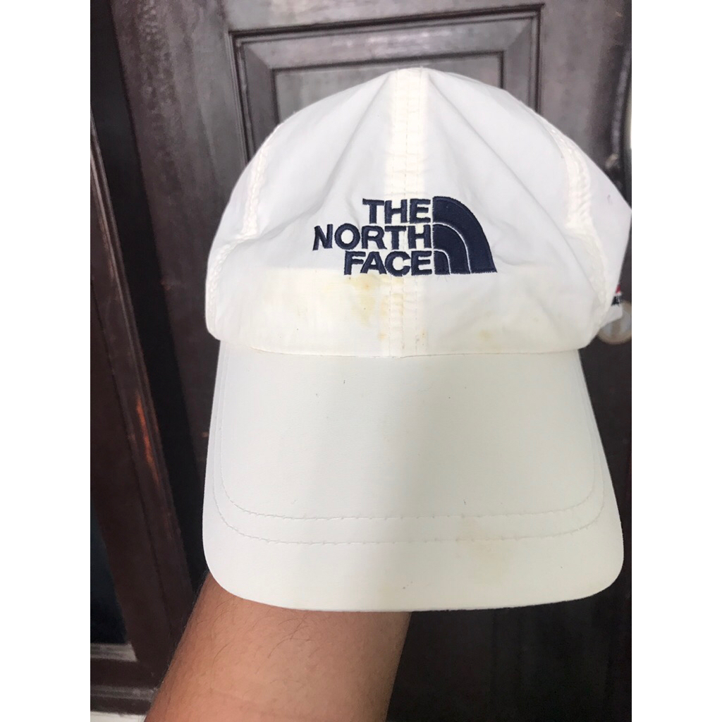 topi tnf putih