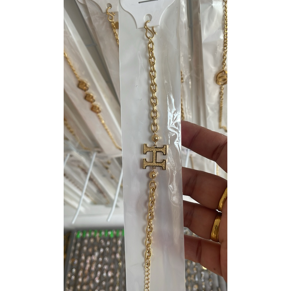 link gelang H motif emas titanium