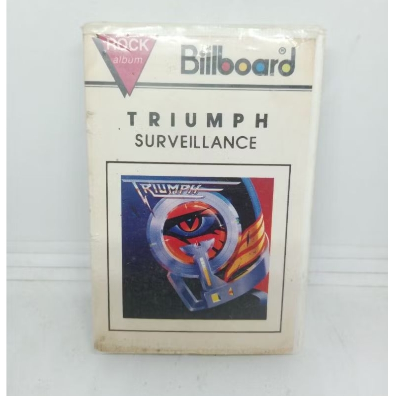Kaset_Pita_Triumph_-_Surveillance_/_Billboard