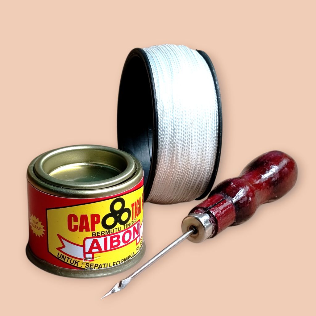 Lem Aibon Kaleng Kecil, jarum jahit sepatu coklat, dan benang putih kecil