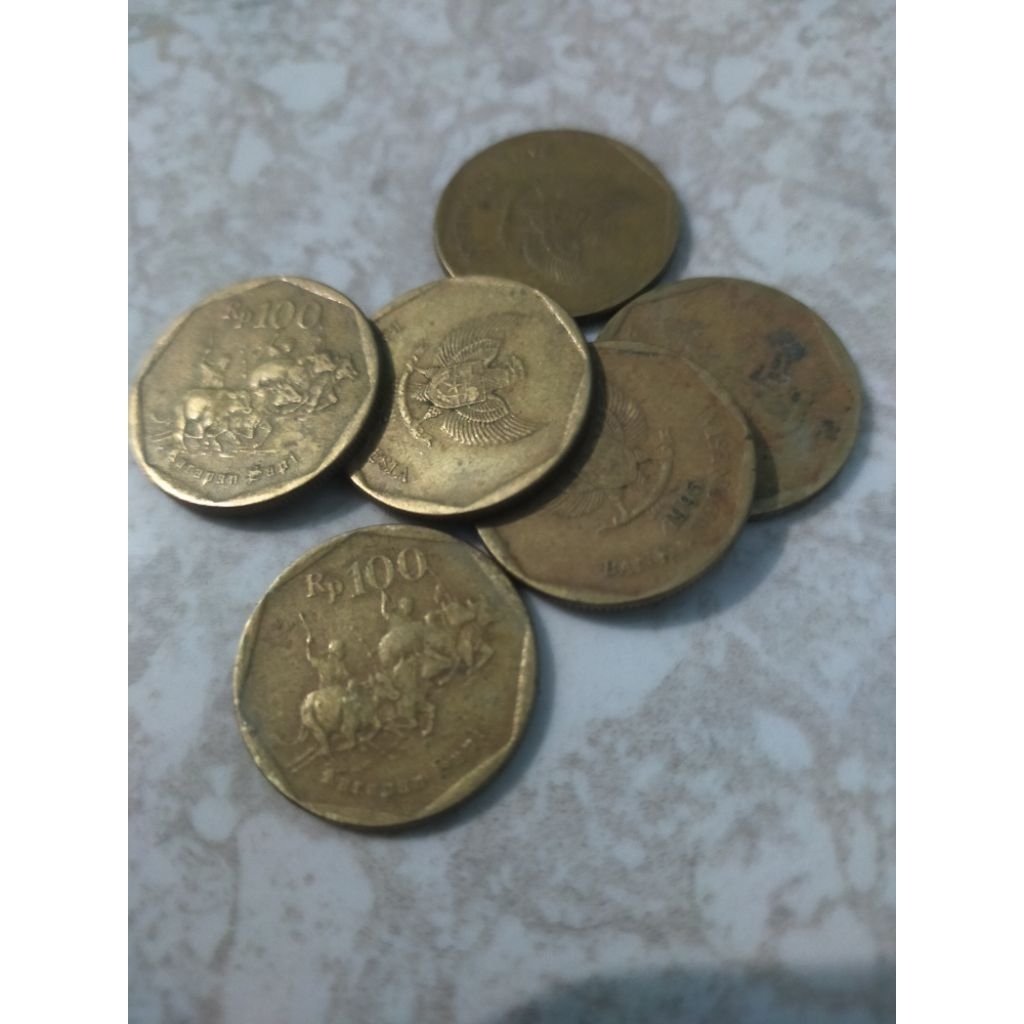uang koin 100 rupiah kuning
