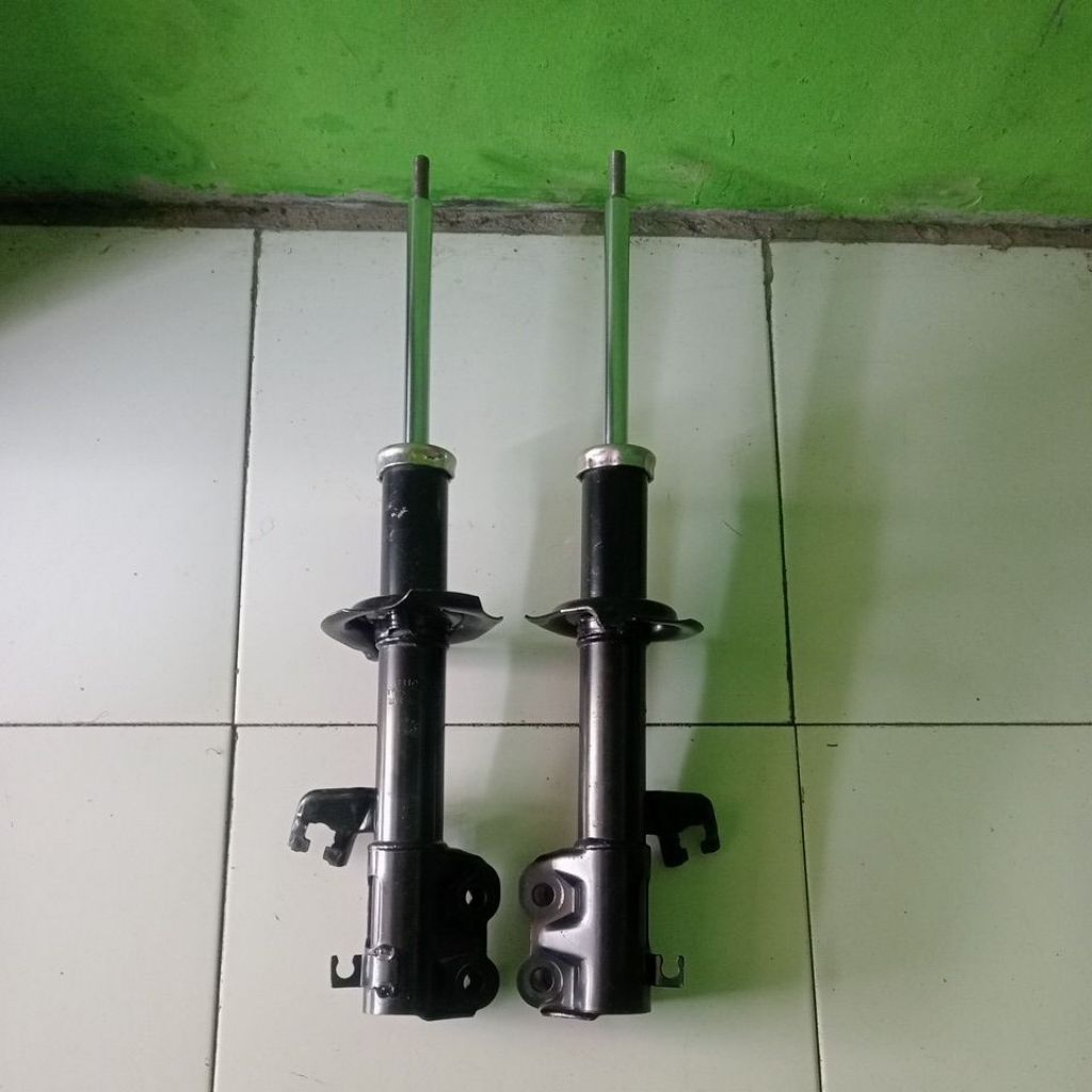 shockbreaker Nissan march depan