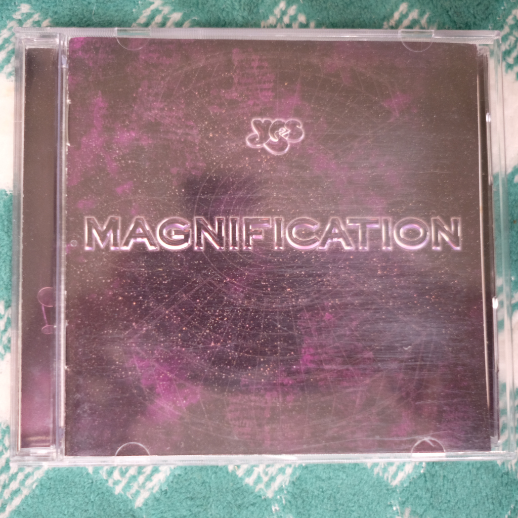CD YES : MAGNIFICATION