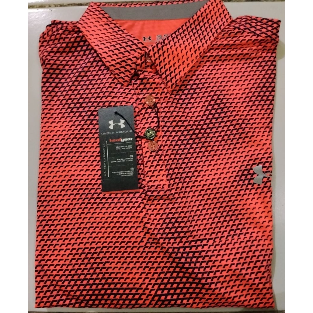Kaos olahraga Golf lengan pendek warna orange sisik bahan Dry Fit merk Under Armour. Produksi Thaila