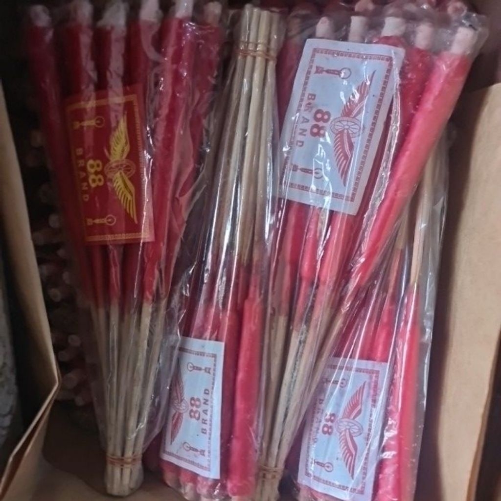 lilin kaki merah bungkusan