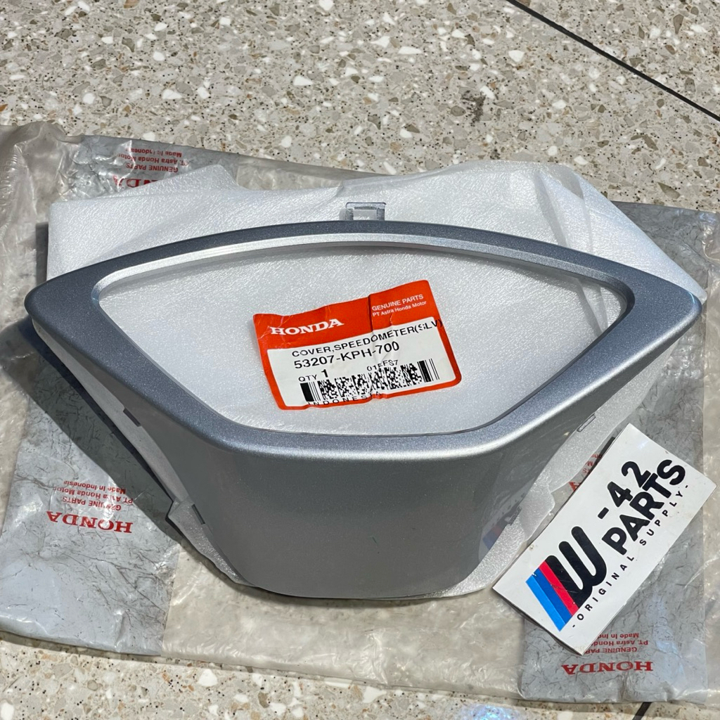 COVER LIST ATAS SPEEDOMETER SUPRA X 125 X125 SERIES SILVER ORIGINAL AHM 53207 KPH 700