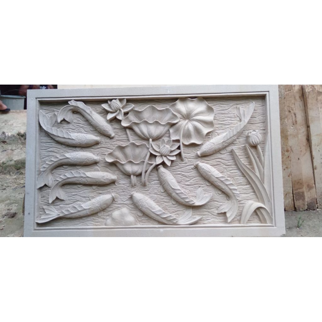 relief ukir batu alam motif ikan