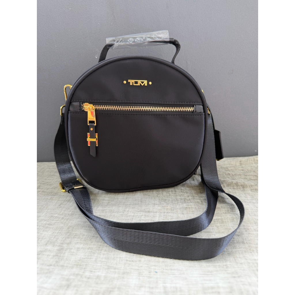 Tas Fashion wanita Tumi Voyageur Compact Round Crossbody Bag
