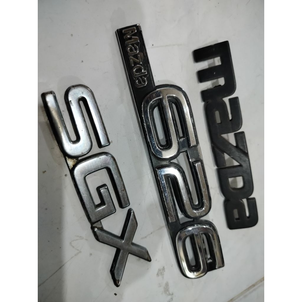 emblem bagasi Mazda 626 sgx