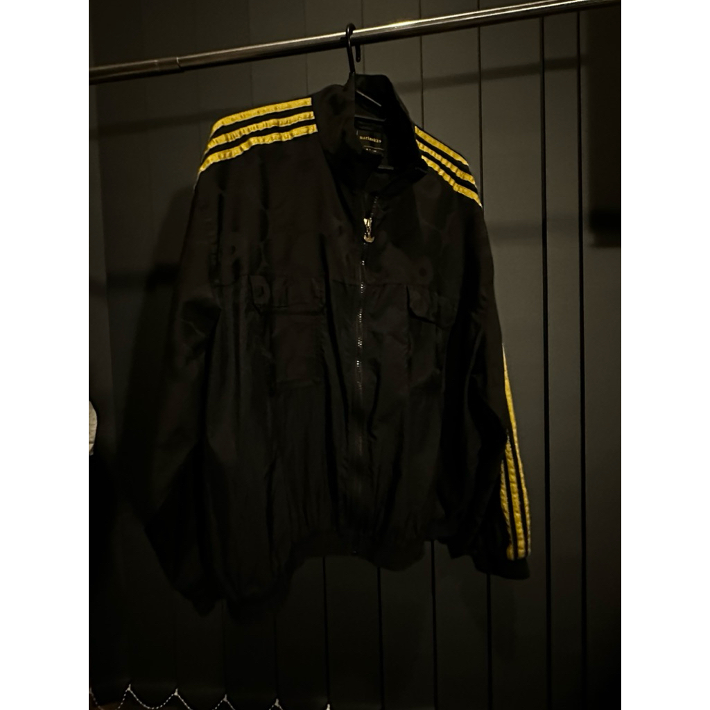 Adidas x Marimekko Primegreen Track Jacket in black with gold stripes