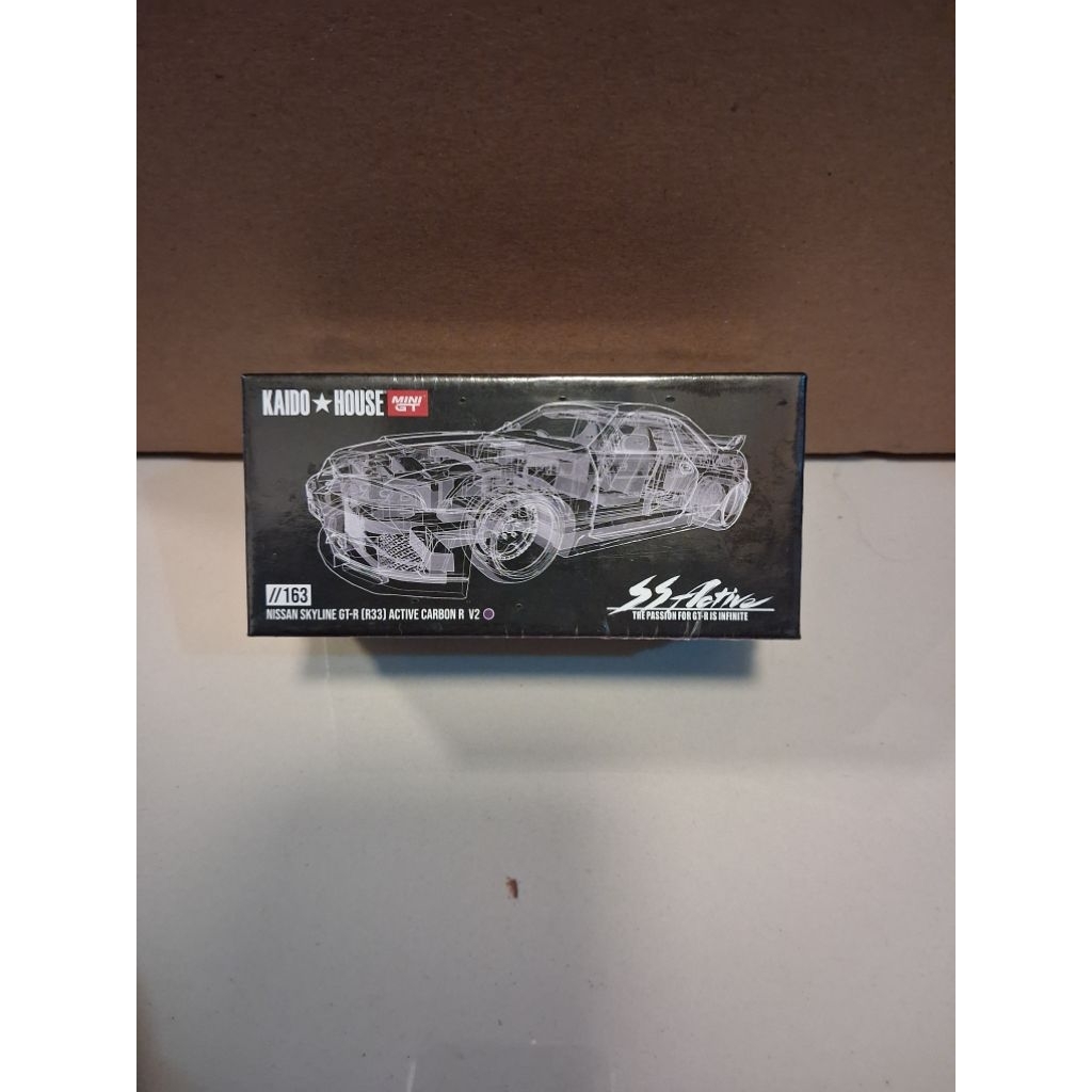 MINIGT KAIDO R33 CARBON