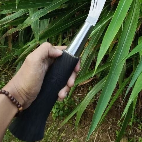 Arit rumput atau hiasan asli madura