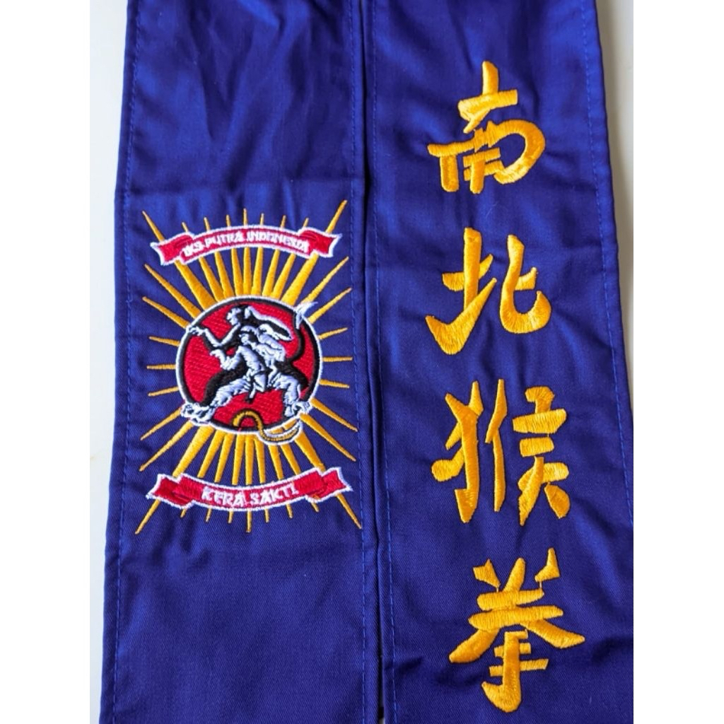sabuk ikspi kera sakti biru bahan drill kain lembut bordir rapi komputer