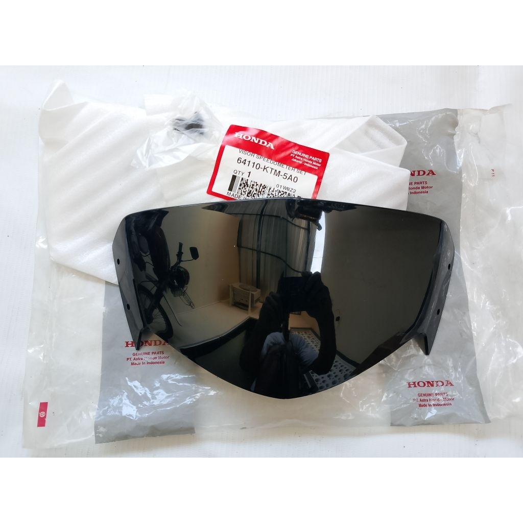 Visor batok lampu Honda SUPRA X 125 Original baru AHM 64110-KTM-5A0