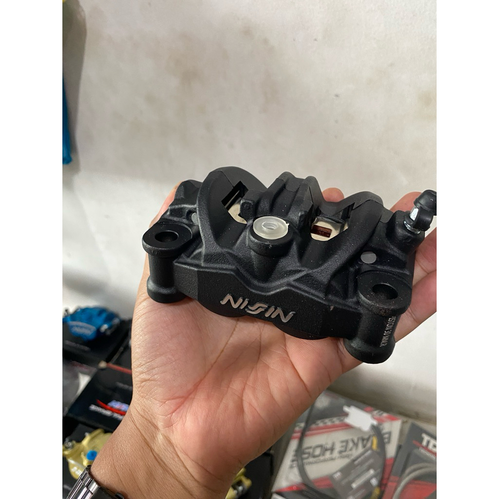 Nissin Kaliper Twin Afrika Monoblok Pitch 100mm untuk Performa Rem Optimal dan Keandalan Tinggi