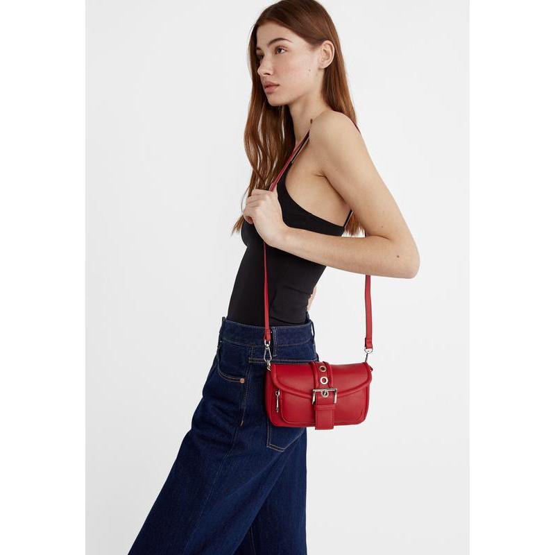 Stradivarius red crossbody bag features a prominent front buckle and chain strap