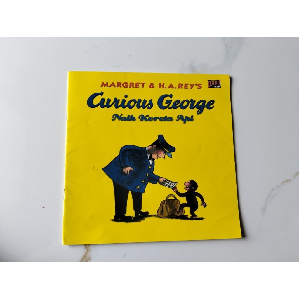 Curious George Naik kereta Api