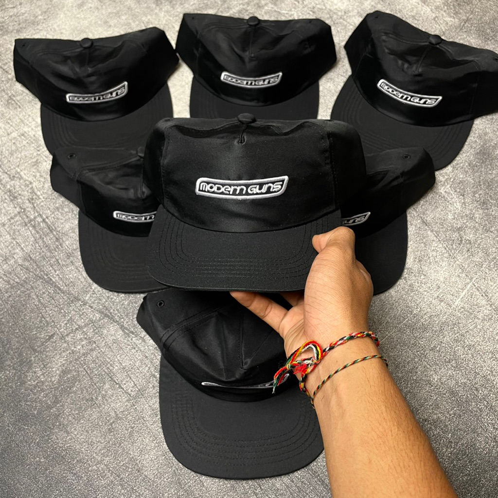 TOPI MODERN GUNS - PURE LOVE Official Merchandise