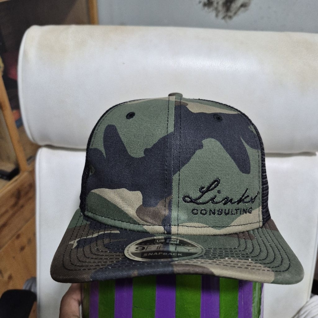 Topi Camo New Era Trucker