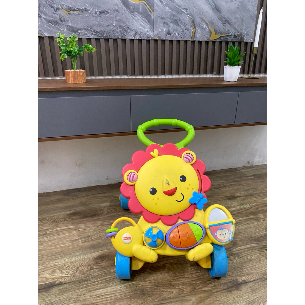 push walker Fisher-Price Musical Lion Walker.