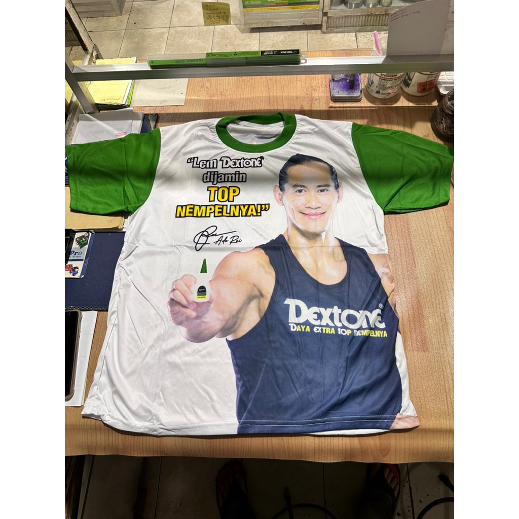 Kaos Iklan Promosi Dextone Ade Rai Pria kekar Berotot Bahan Super Adem Kunyur Kunyur Ganteng Maksima