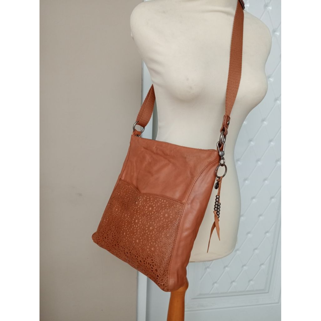 The Sak sling bag kulit asli w perforated leather