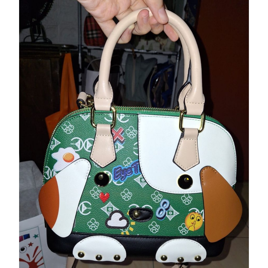 sling top handle huer eye theme