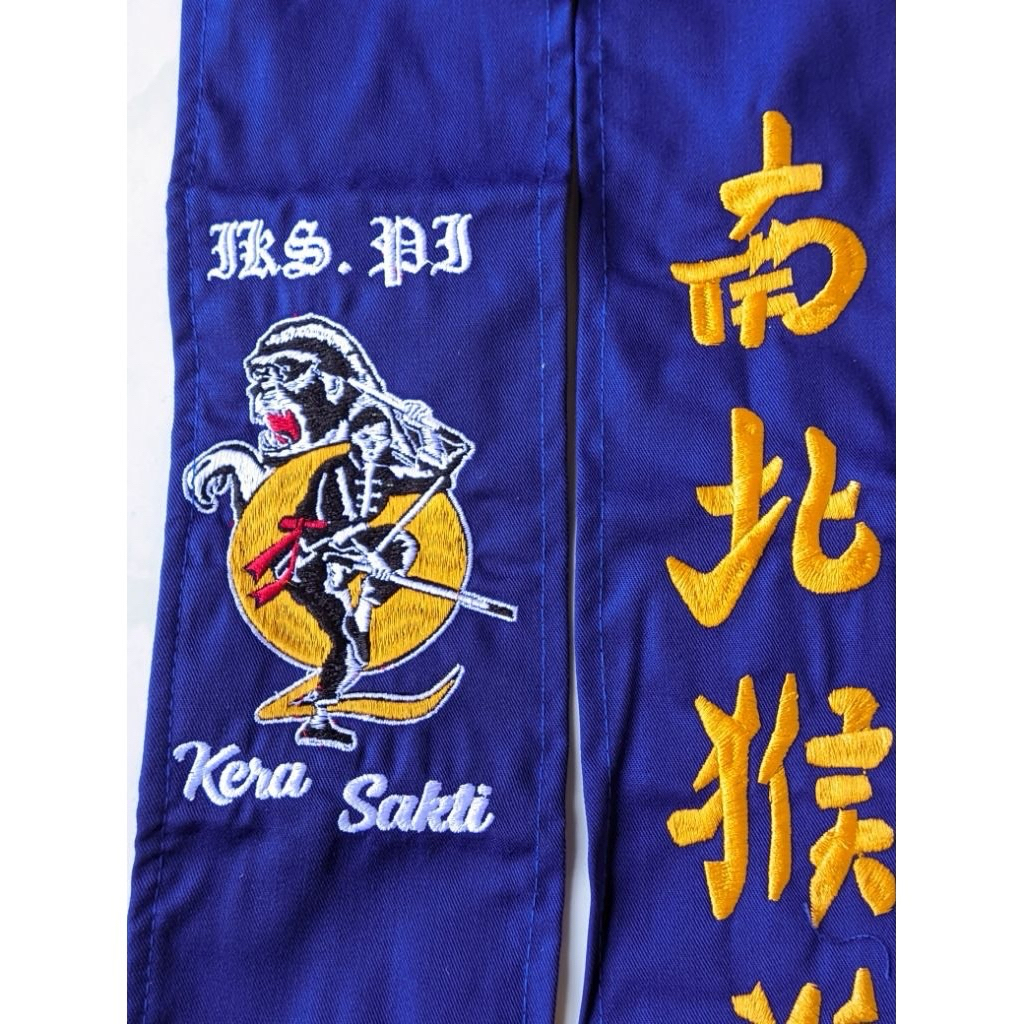 sabuk ikspi kera sakti biru bahan drill kain lembut bordir rapi komputer