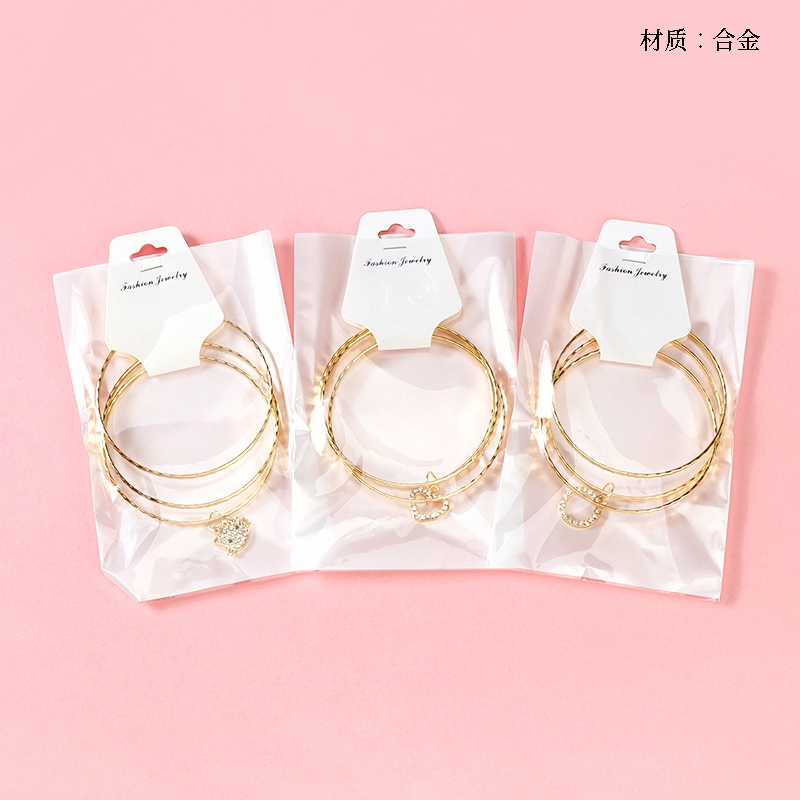 Gelang liontin berlian penuh emasSet gelang dan gelang emas paduan, pita daun manis + bintang berlia