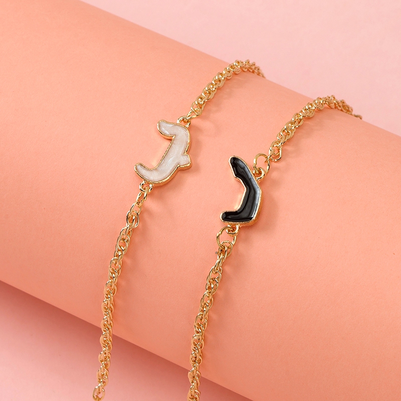 Gelang aksesori tetesan minyak yang modisGelang Inisial Huruf Couple Sahabat Enamel Hitam Putih Emas