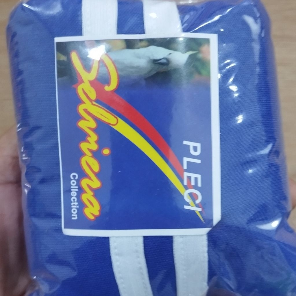 selimut kurung burung peleci