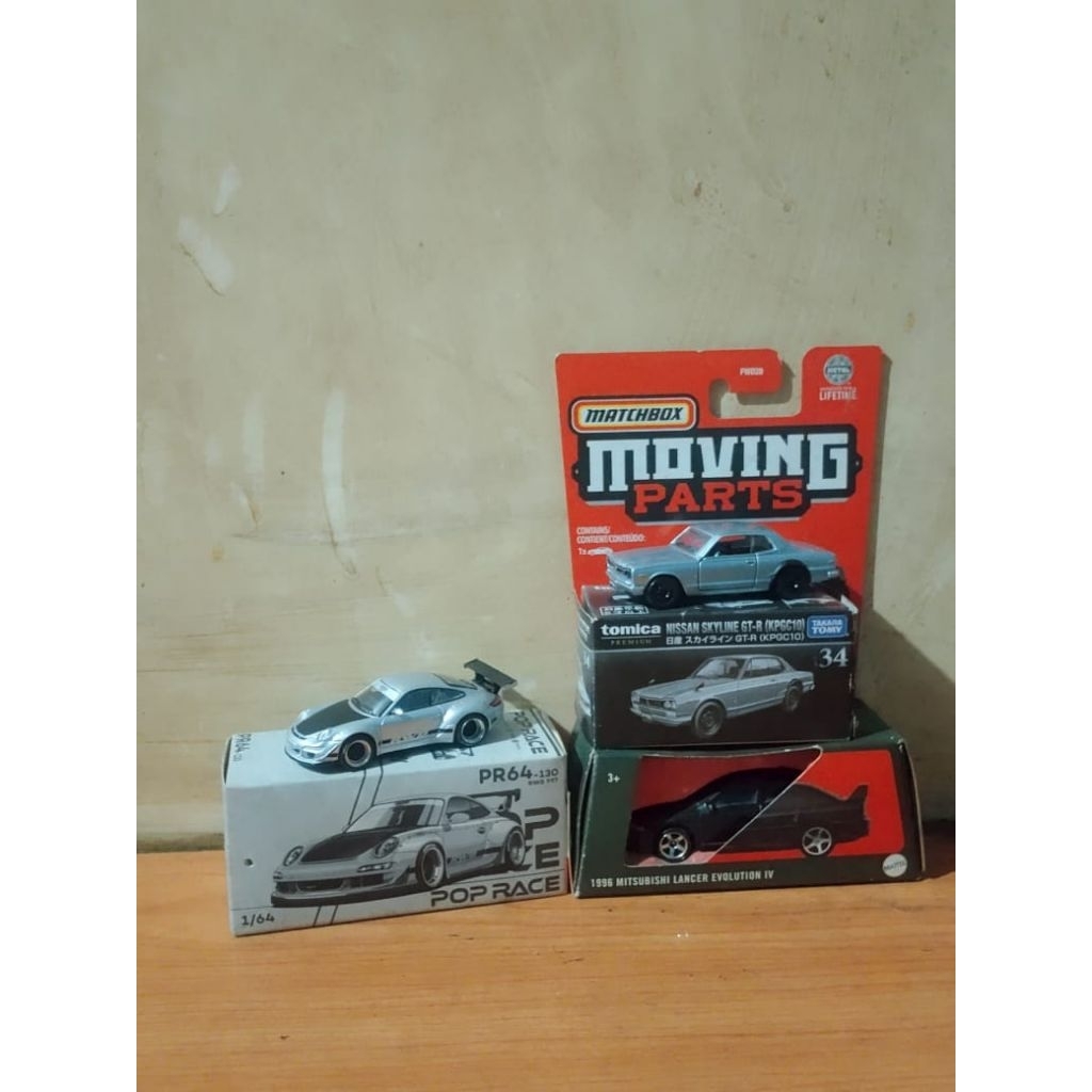 Moving Parts Evo lancer + Tomica Nissan