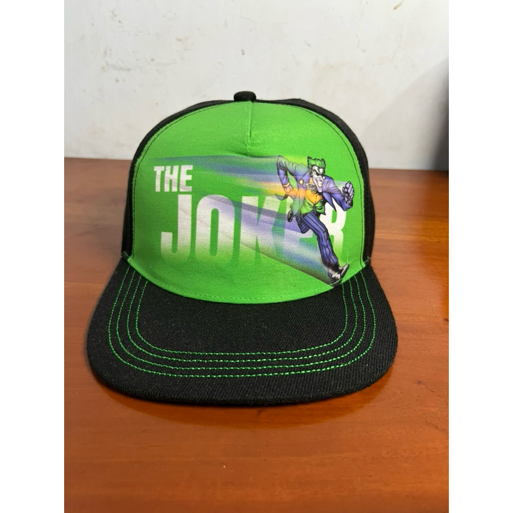 topi karakter the joker aop by six flag original second