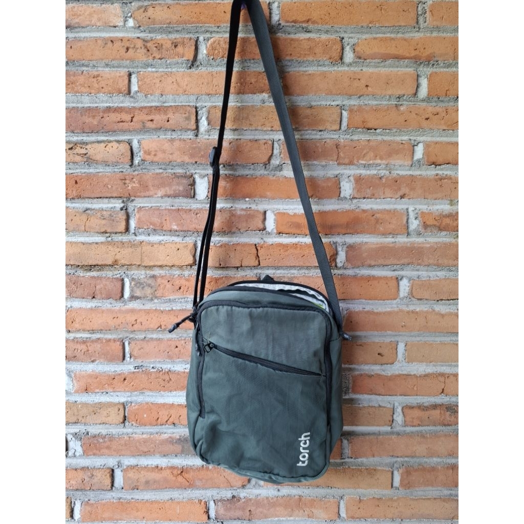 torch tablet sling bag