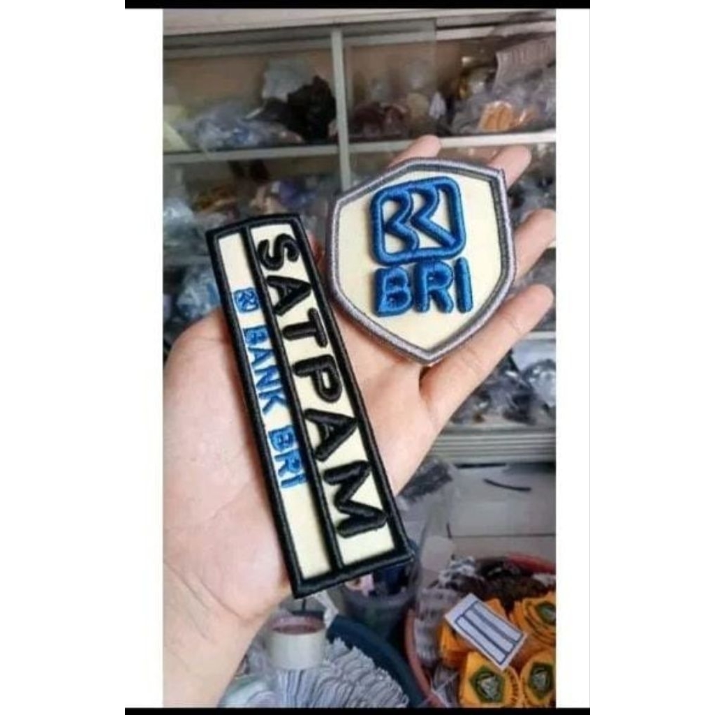 Nama/satpam dan logo perusahaan bordir timbul