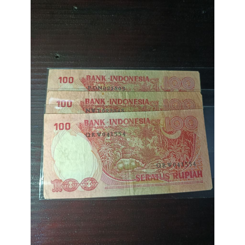 uang kertas kuno 100 badak kondisi bekas edar
