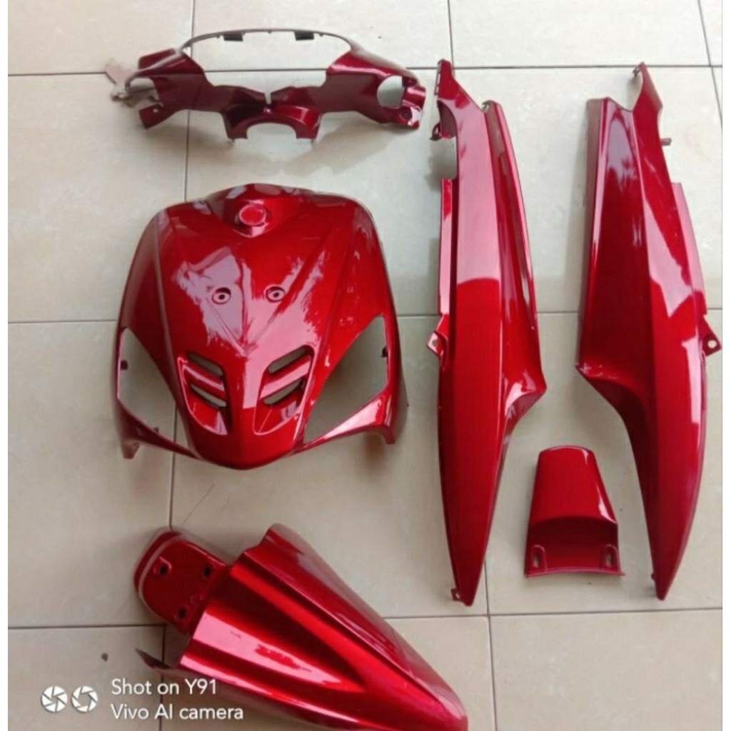 Set Body Halus Yamaha Mio Sporty asli dengan warna biru tua metalik glossy, cocok untuk meningkatkan