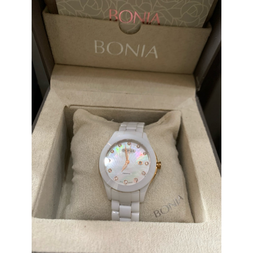 Bonia ceramic women's watch with a white mother-of-pearl dial and crystal hour markers. Jam tangan w