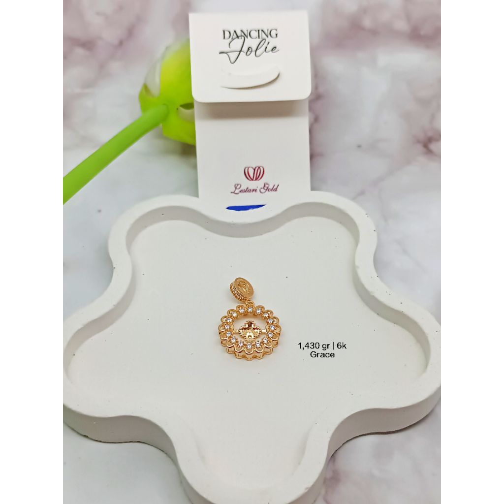 Liontin emas muda asli model bunga kadar 300/6k