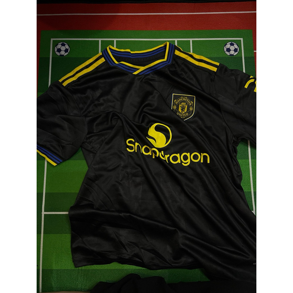 (FANS)Jersey Manchester United Hitam Kuning – Baju Bola MU Premium