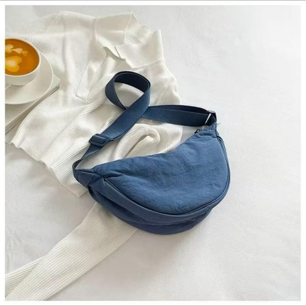 Tas Selempang Uniqlo Half Moon Bag Unisex Nilom Water Proof