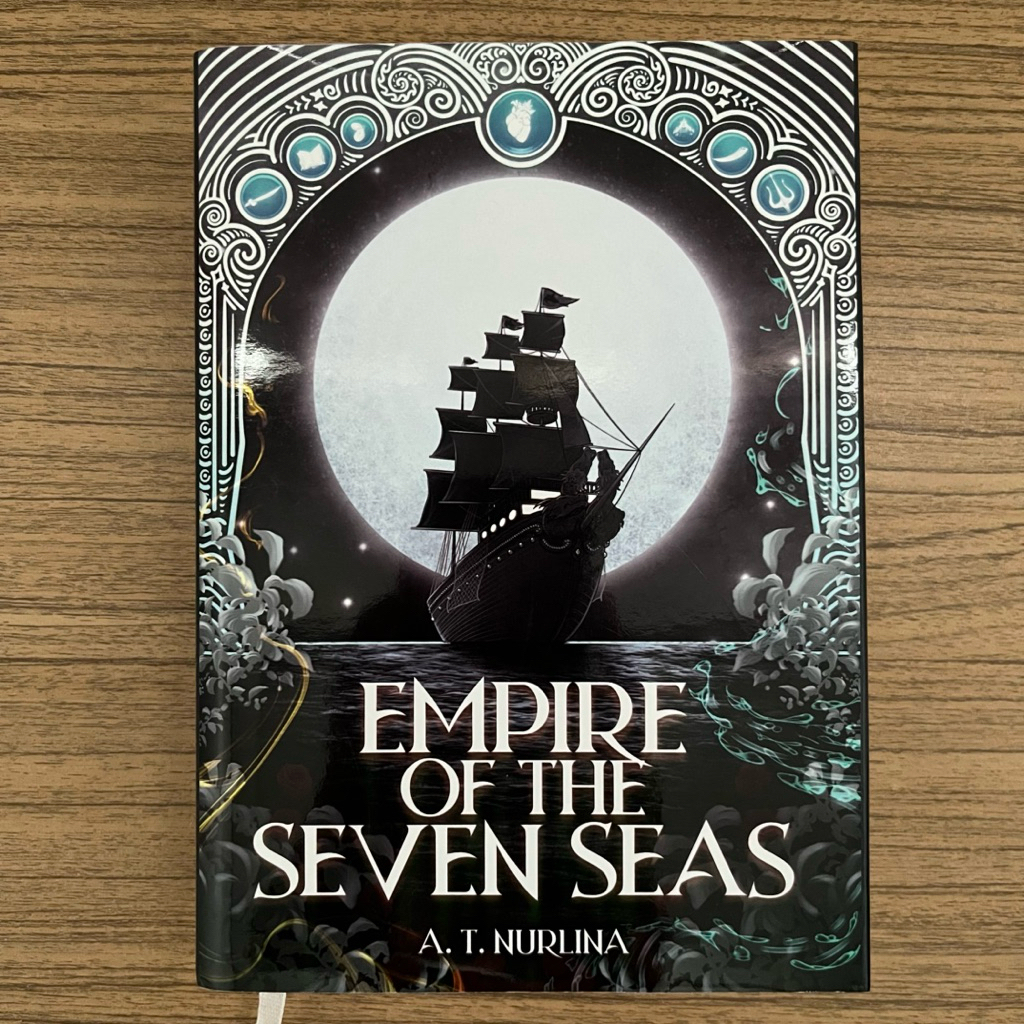 Preloved Novel Empire of The Seven Seas + Jacketbook + Postcard dll (lihat gambar) - A.T. Nurlina