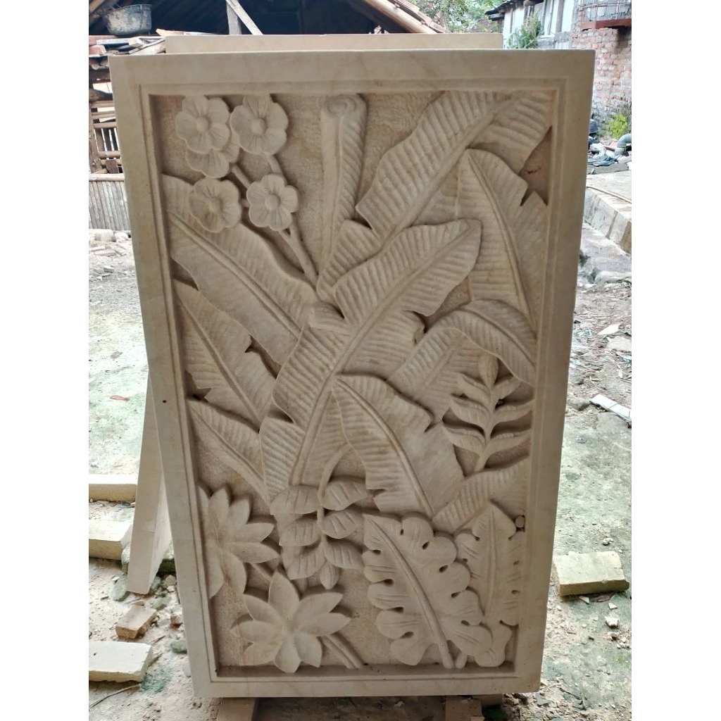 relief batu ukir dinding rumah