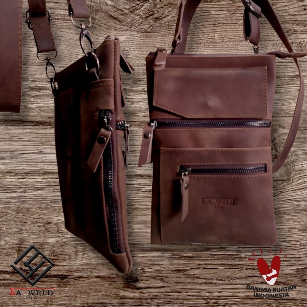 Tas Slempang pria kulit Asli100%. Terdapat slot tempat HP, rokok, Dompet & Accessories lainnya.